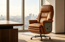 Premium executive genuine‑leather office chair in sunlit high‑rise executive office workspace