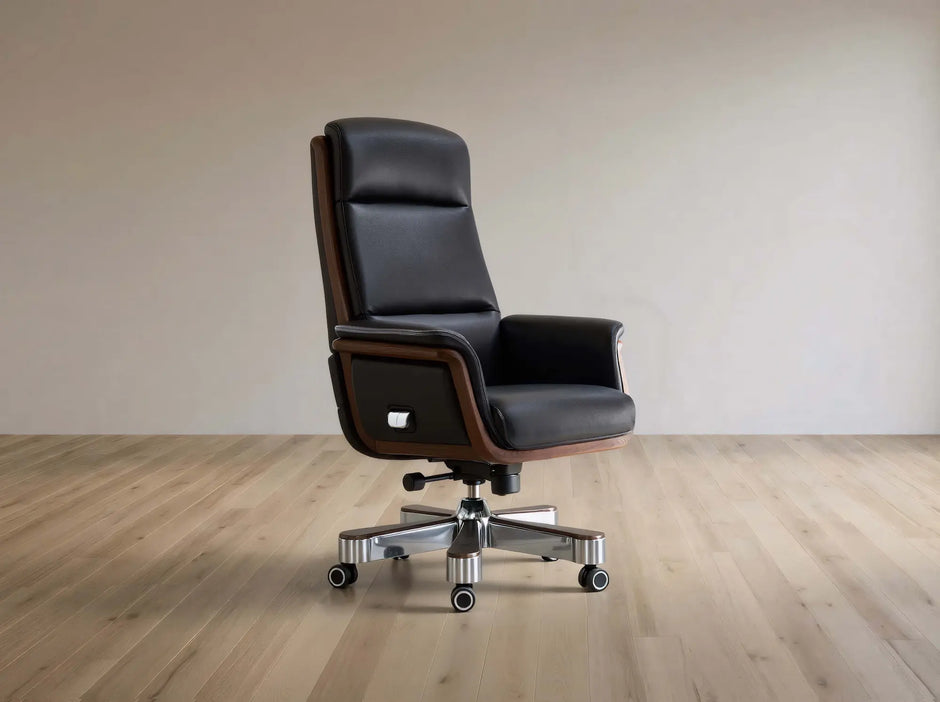 Black leather office chair on a wooden floor with a plain wall background