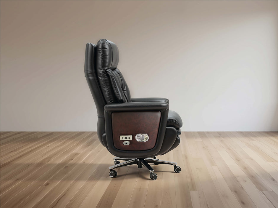 A black leather office chair with a dark wood panel on the side, featuring a headrest, adjustable armrests, and a five-star wheeled base, shown in a minimalist room setting with light wood floors and a beige wall.