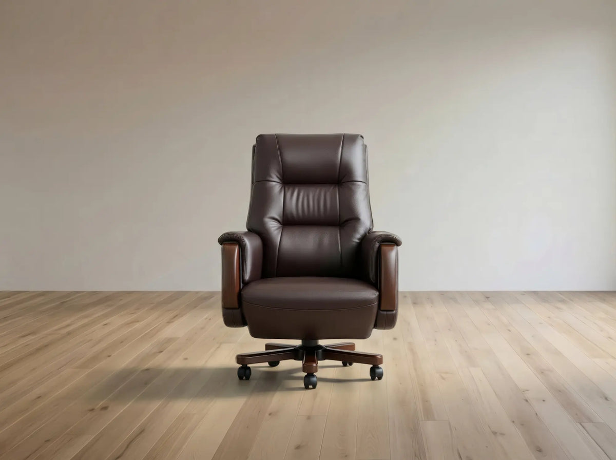 A dark brown leather office chair with wooden armrests and a black five-star wheeled base, positioned centrally on a light wood floor against a neutral beige wall.