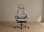 Gray office chair on a wooden floor with a beige wall background