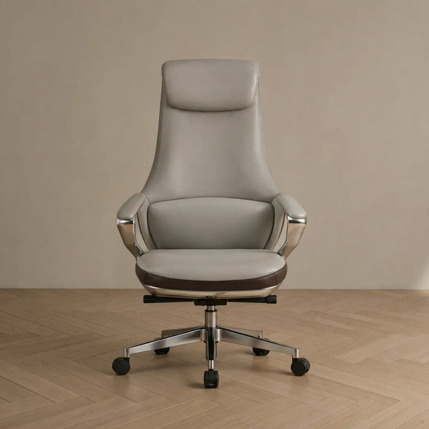 Gray office chair on a wooden floor with a beige wall background