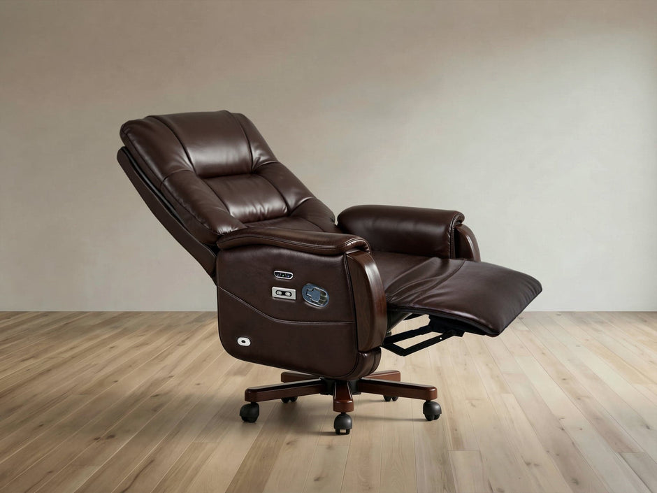 A dark brown leather recliner office chair with the footrest extended, set against a neutral beige wall and light wood floor.