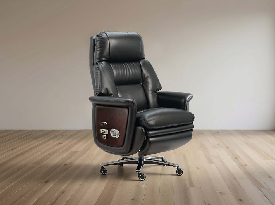 A black leather high-back office chair with a wood-grain side panel and five-wheel casters, shown in a minimalist room with light wood floors and a beige wall.