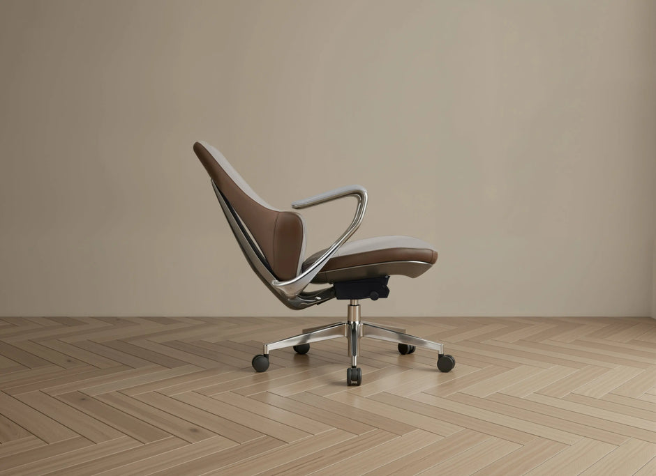 Modern office chair with brown seat and backrest on a wooden floor.