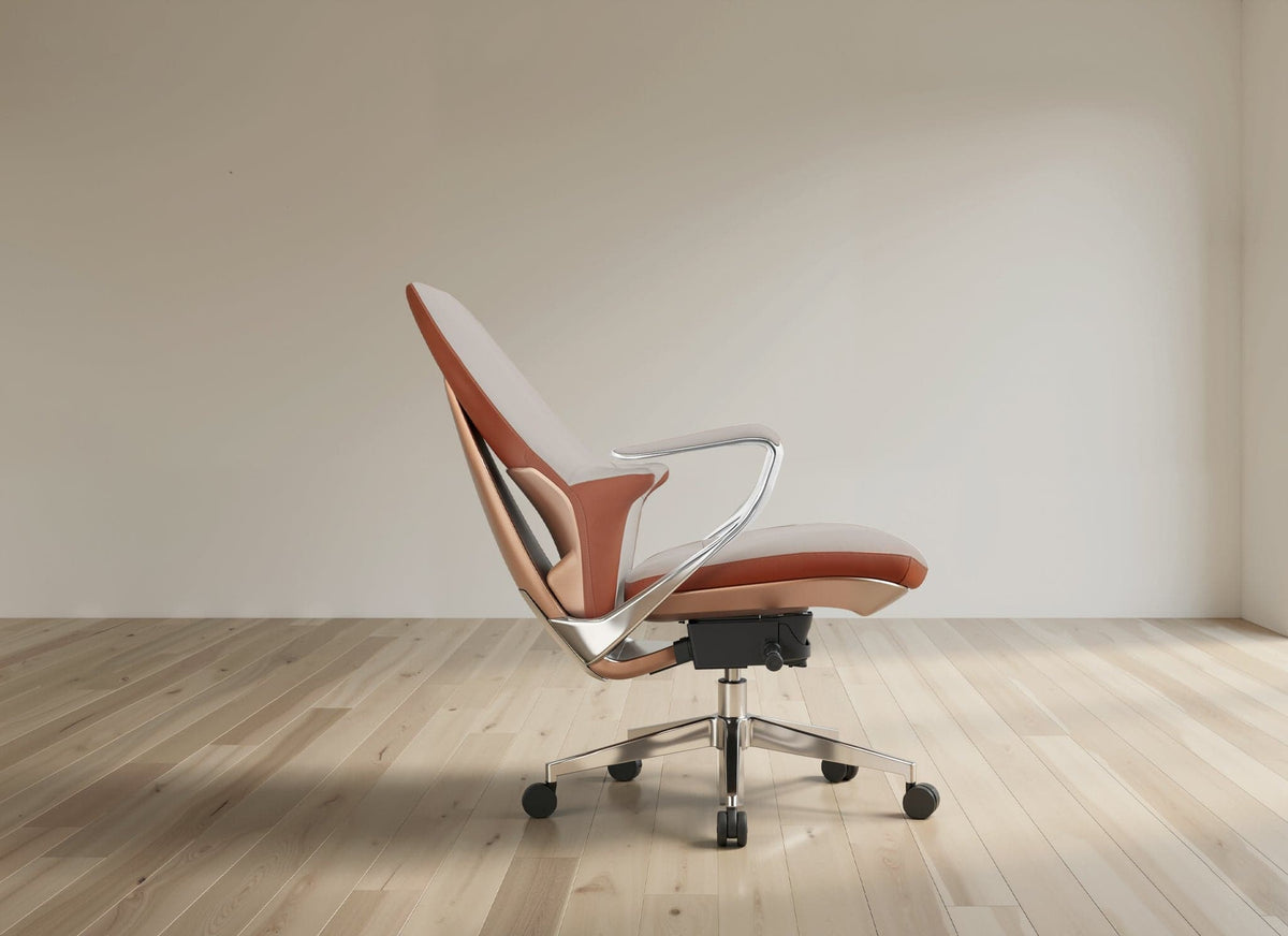 A modern ergonomic office chair with a curved backrest, upholstered in a terracotta orange and beige leather-like material, featuring a chrome metal armrest and a five-star black wheeled base, set against a minimalist beige wall and light wood floor.