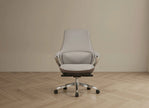 Gray office chair on a wooden floor with a beige wall background