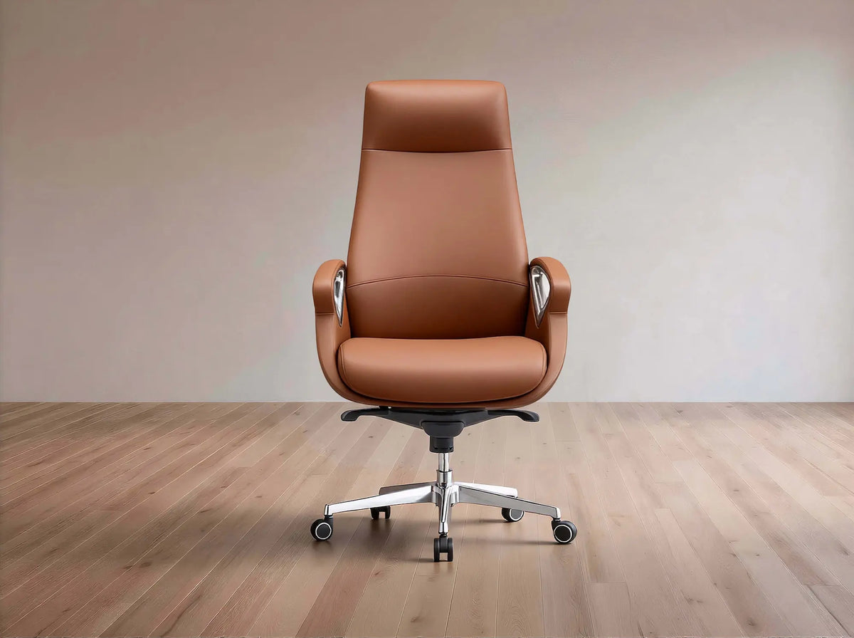 A high-back brown leather office chair with a chrome five-star base and casters, set against a minimalist beige wall and light wood floor.