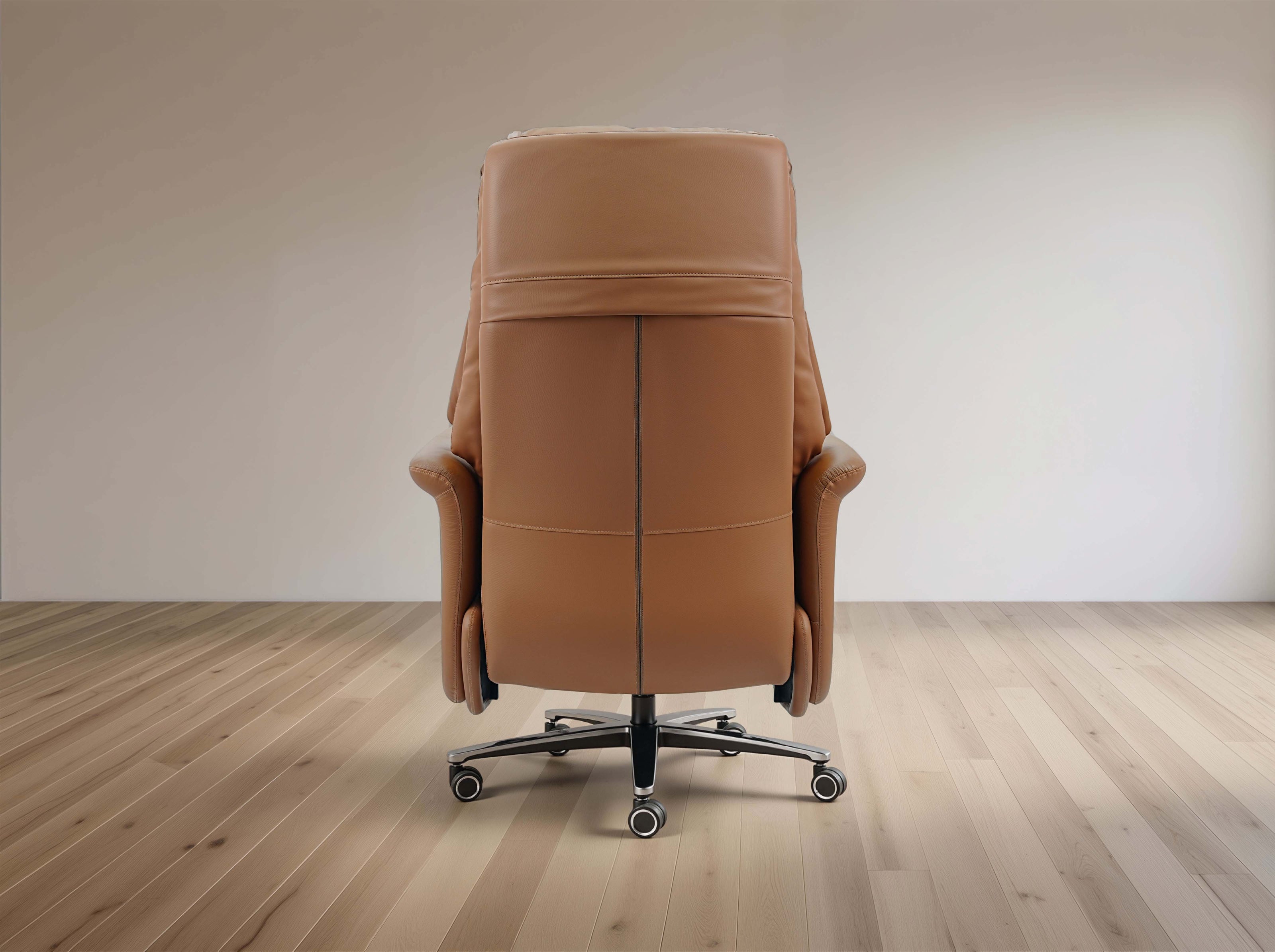 Brown leather recliner chair on a wooden floor with a plain wall background