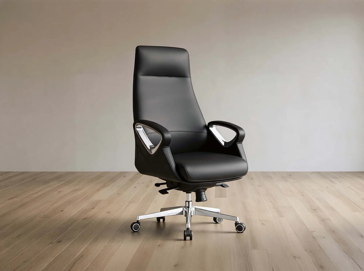 A modern black leather high-back office chair with chrome armrest supports and a five-star wheeled base, set against a minimalist beige wall and light wood floor.