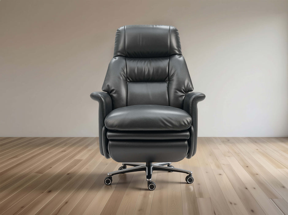 Black leather recliner chair on a wooden floor with a plain wall background