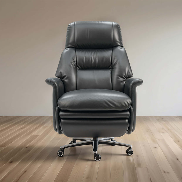 Black leather recliner chair on a wooden floor with a plain wall background