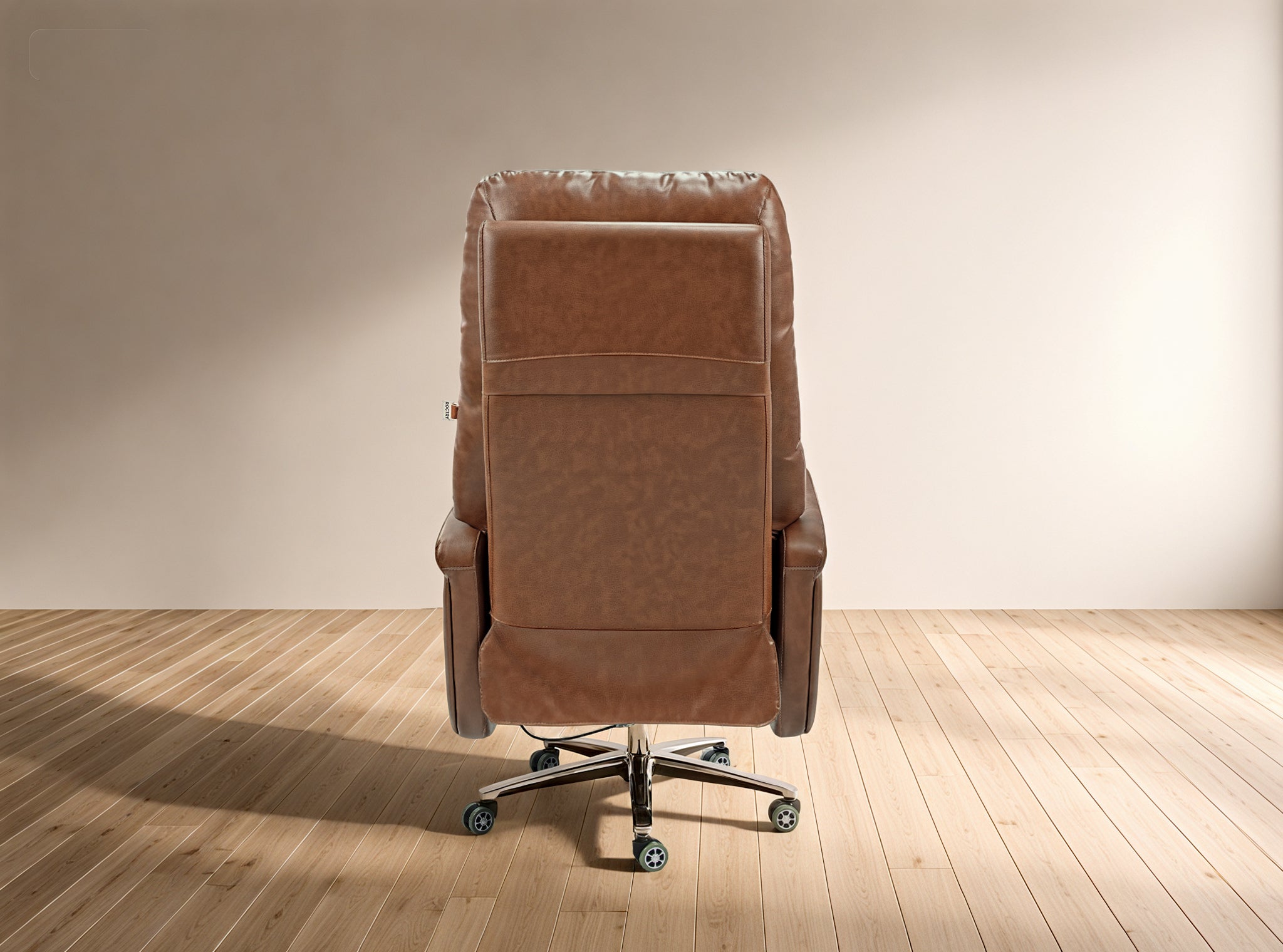 Brown leather recliner chair on a wooden floor with a beige wall background