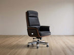 Black office chair with wooden accents on a wooden floor.